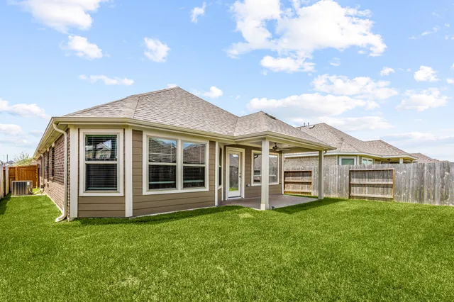 a view of a house with a garden and plants