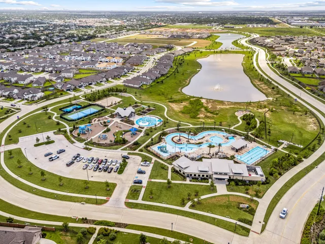 an aerial view of residential houses with outdoor space