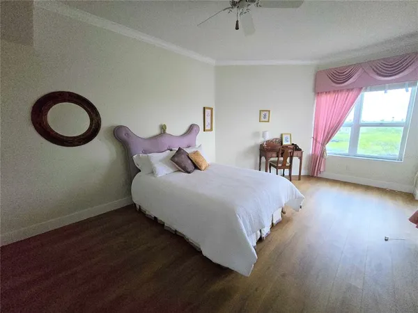 a bed room with a bed and a chair