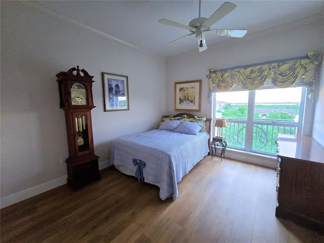a bedroom with a bed and a tv on table