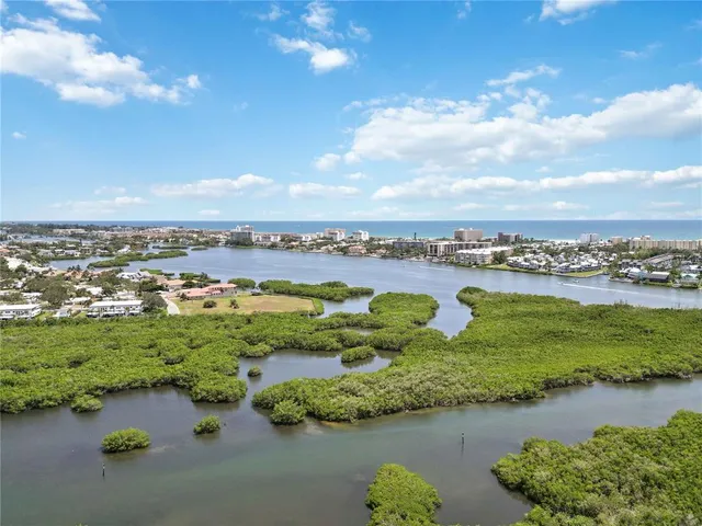 a view of a lake with houses in the back