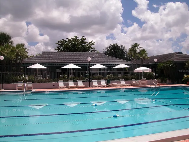 a view of a table and chairs under an umbrella