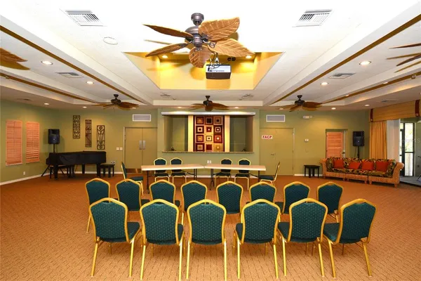 a dining room with furniture and chandelier