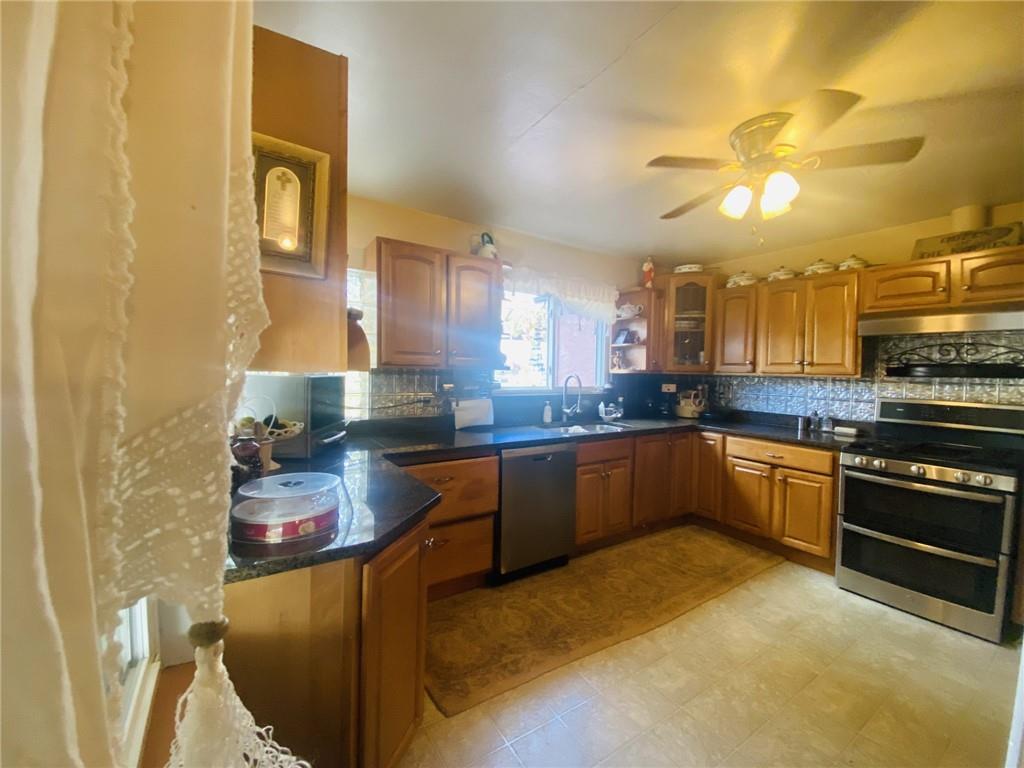 16 Coates Avenue New Castle, PA 16101 - Photo 14 of 23 a kitchen with cabinets and appliances