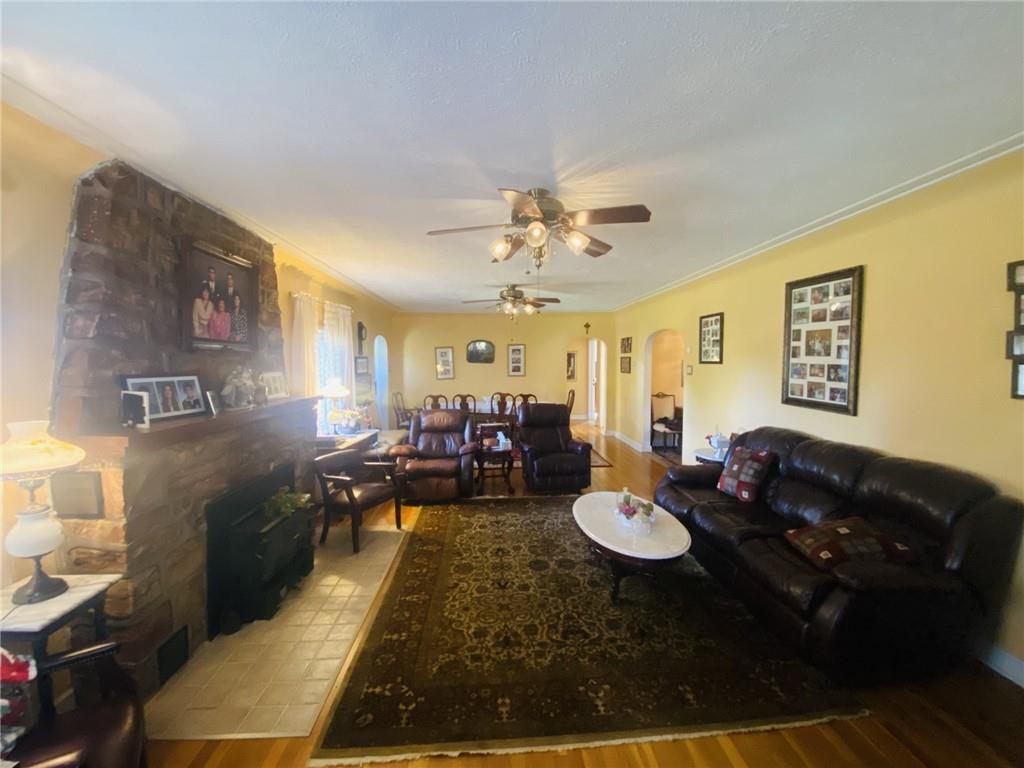 16 Coates Avenue New Castle, PA 16101 - Photo 5 of 23 a living room with furniture flowerpot and a chandelier