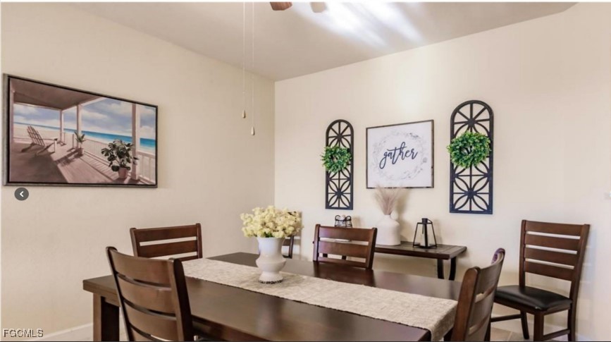 16572 San Edmundo Road, Unit 122 Punta Gorda, FL 33955 - Photo 11 of 23 a dining room with furniture and wooden floor