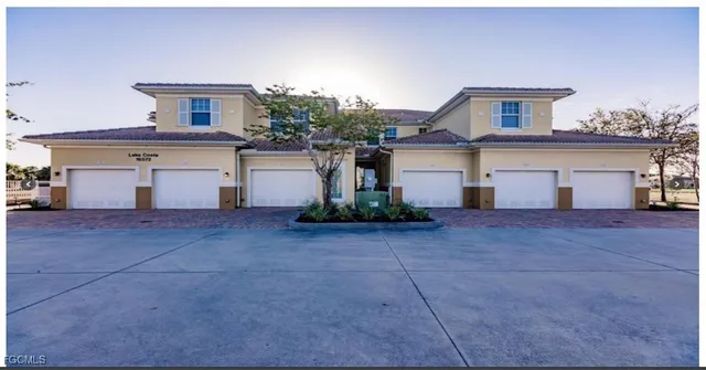a front view of a house with garage
