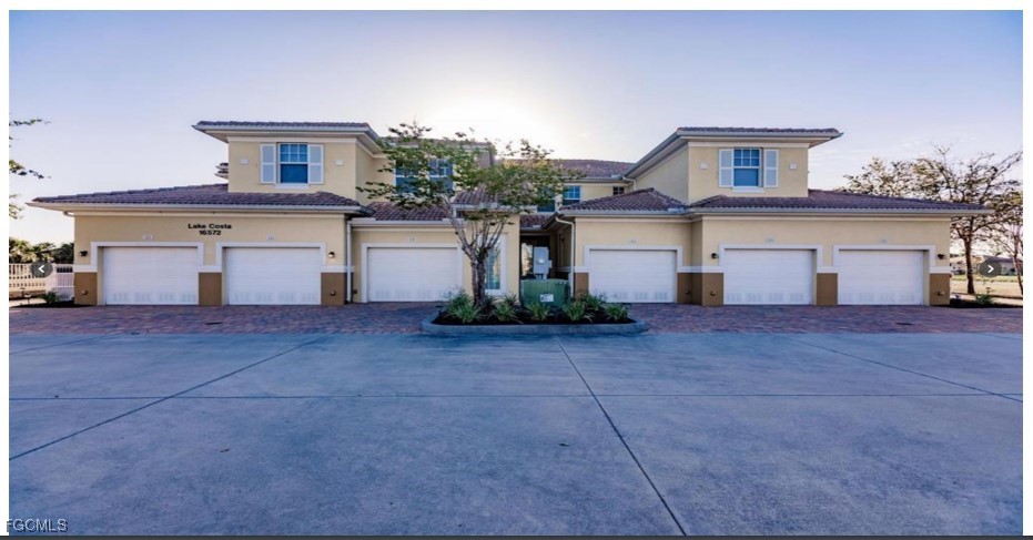 16572 San Edmundo Road, Unit 122 Punta Gorda, FL 33955 - Photo 2 of 23 a front view of a house with garage