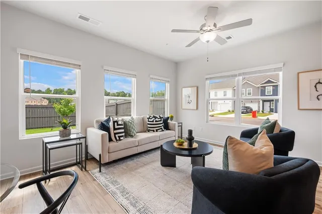 a living room with furniture and a large window