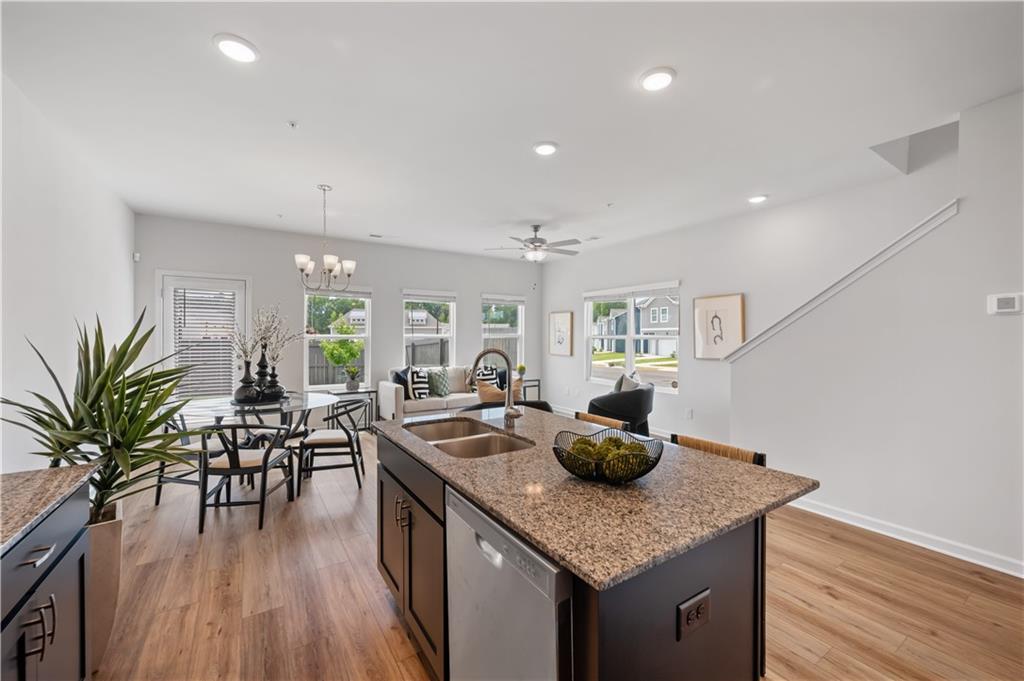 9435 Maple Grv Lane, Unit 97 Jonesboro, GA 30238 - Photo 5 of 17 a kitchen with counter space and wooden floor