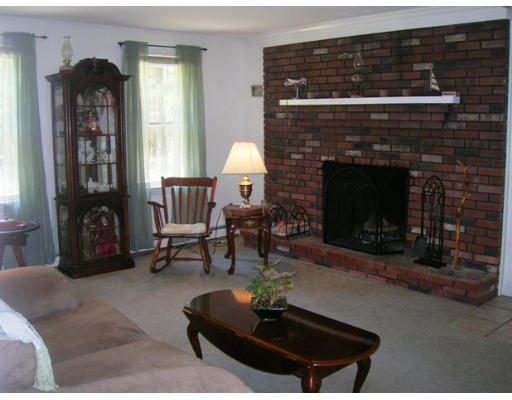 45 Brooks Village Road Phillipston, MA 01331 - Photo 5 of 12 a living room with furniture and a fireplace
