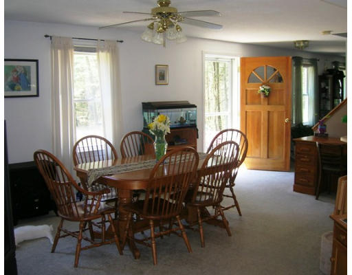 45 Brooks Village Road Phillipston, MA 01331 - Photo 8 of 12 a dining room with furniture potted plants and wooden floor