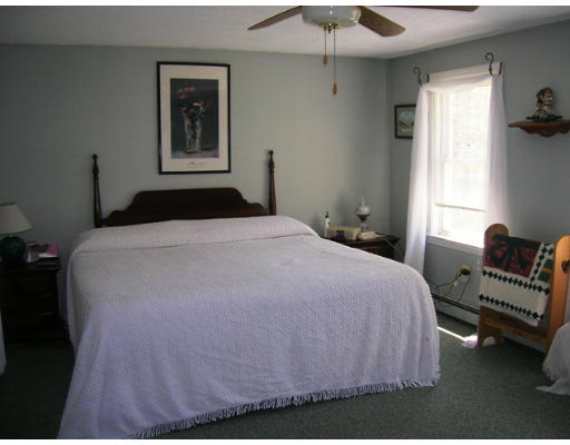 45 Brooks Village Road Phillipston, MA 01331 - Photo 9 of 12 a bedroom with a bed and a window