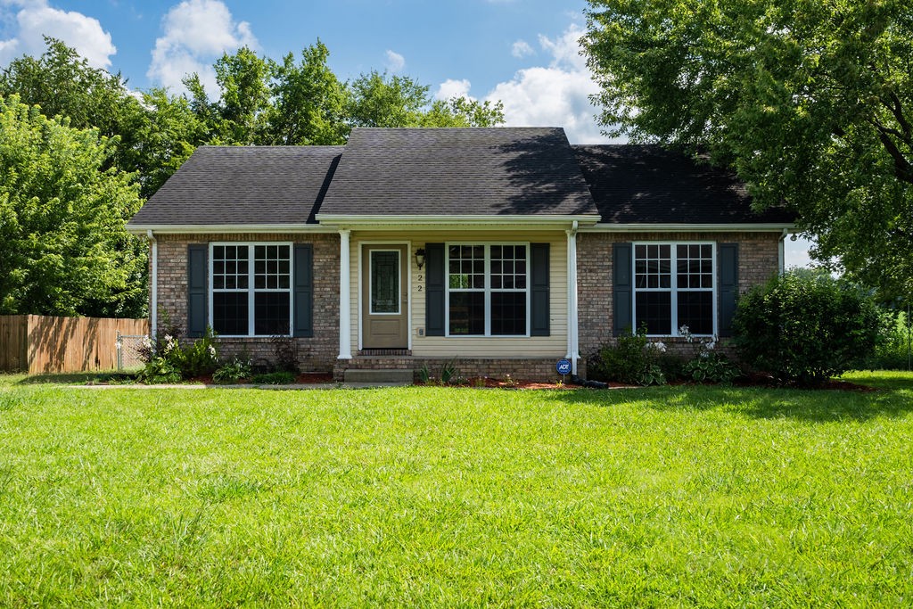 front view of a house with a garden