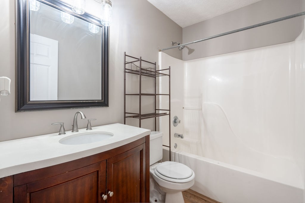 122 Cora Street Portland, TN 37148 - Photo 14 of 28 a bathroom with a sink toilet and shower