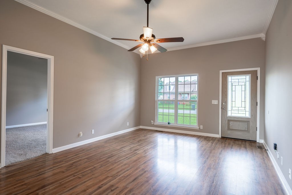 122 Cora Street Portland, TN 37148 - Photo 18 of 28 wooden floor in an empty room with a window