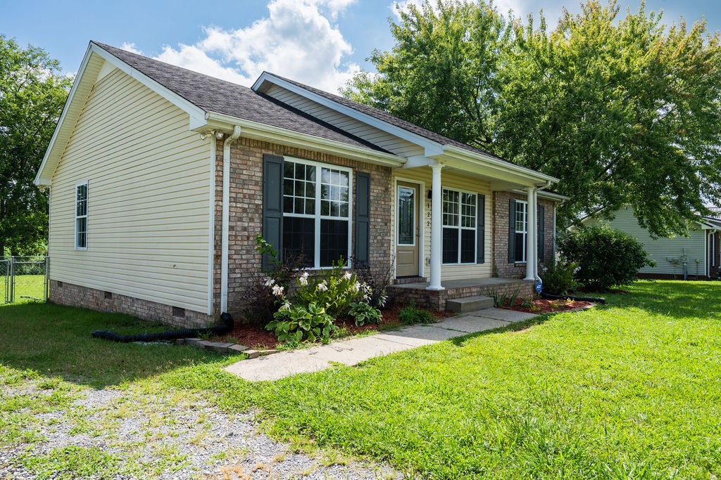 122 Cora Street Portland, TN 37148 - Photo 2 of 28 a view of a house with backyard and sitting area