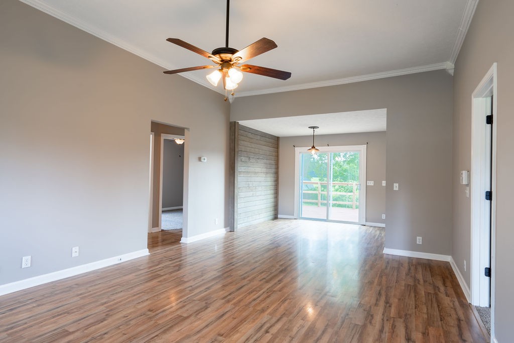 122 Cora Street Portland, TN 37148 - Photo 21 of 28 a view of an empty room with wooden floor and a window