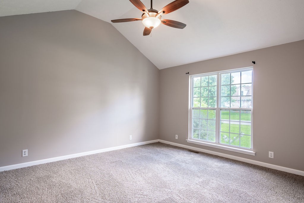 122 Cora Street Portland, TN 37148 - Photo 22 of 28 an empty room with windows and fan