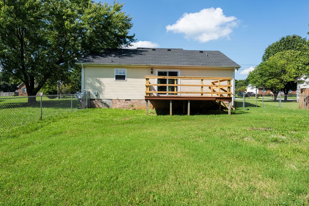 122 Cora Street Portland, TN 37148 - Photo 5 of 28 a view of a house with a backyard