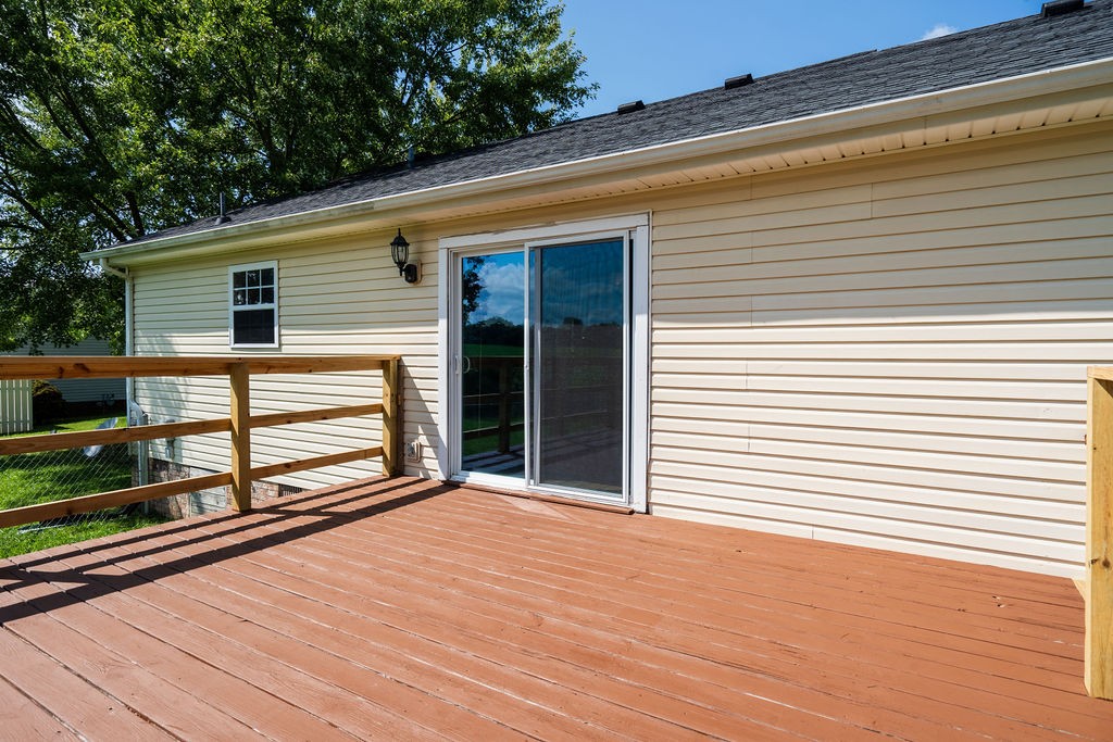 122 Cora Street Portland, TN 37148 - Photo 6 of 28 a view of backyard with deck and large trees