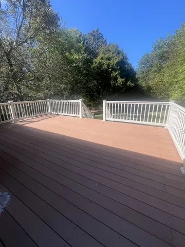 a view of balcony with wooden floor and outdoor space