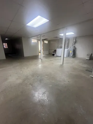 a bedroom with furniture and flat screen tv