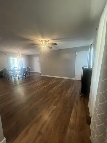 a view of a livingroom with wooden floor