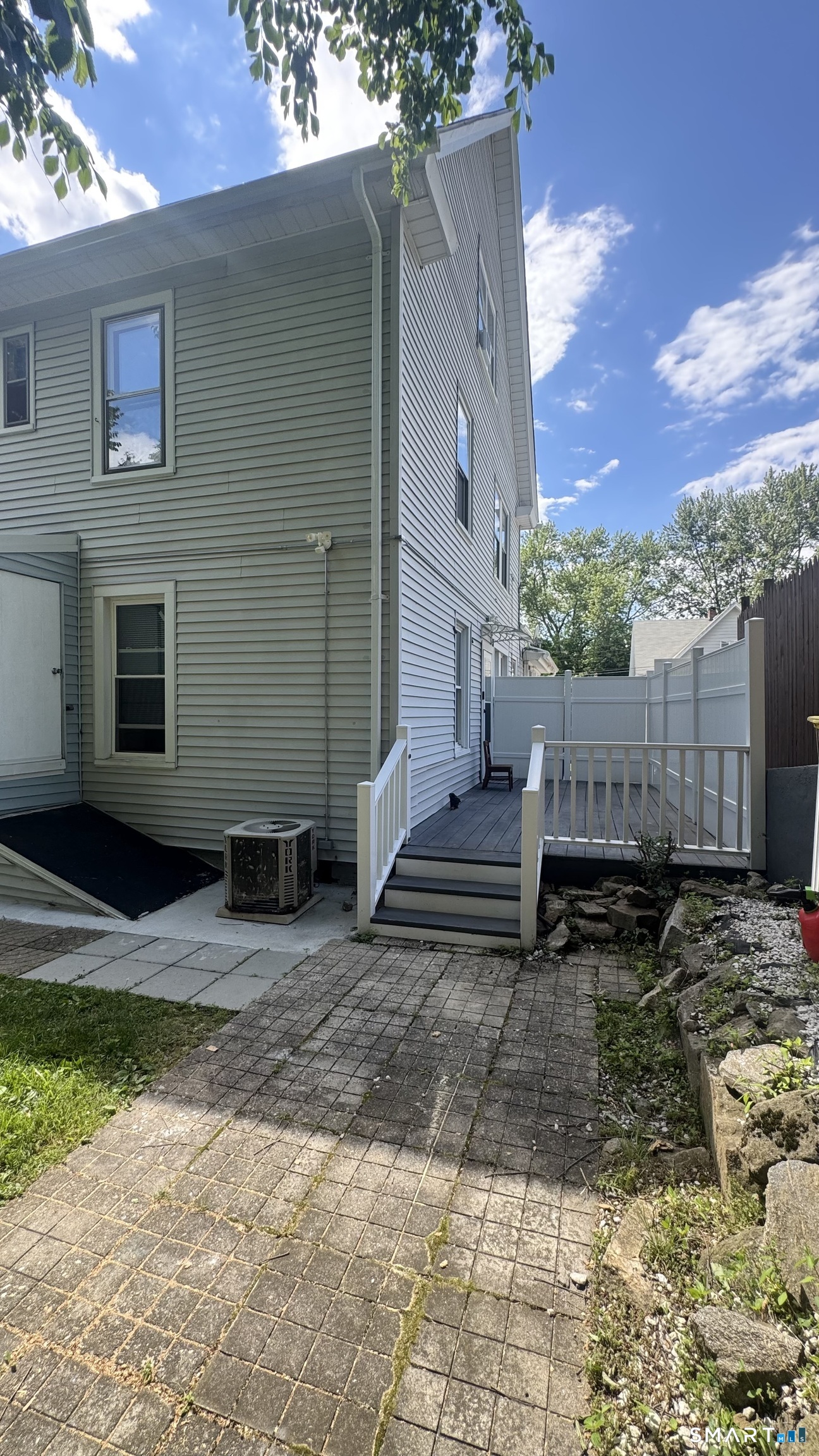 104 Prospect Street Ansonia, CT 06401 - Photo 11 of 40 a view of house with backyard space and wooden fence