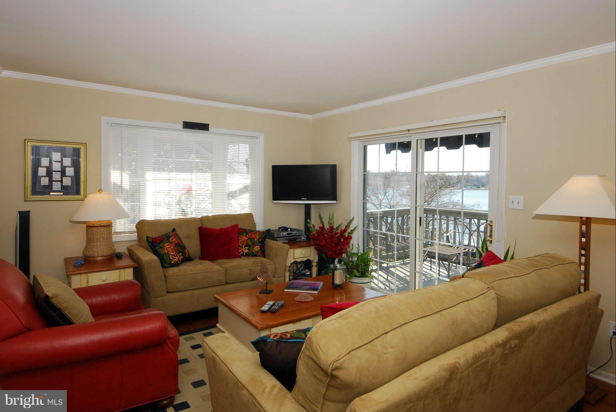 229 Cape St John Road Annapolis, MD 21401 - Photo 4 of 30 Living room opens to a waterside balcony