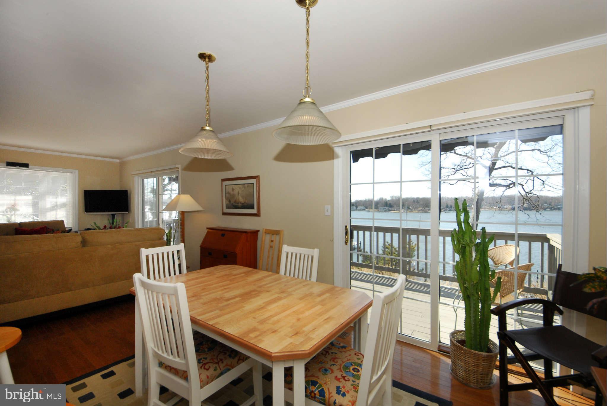 229 Cape St John Road Annapolis, MD 21401 - Photo 7 of 30 Dining area opens to the waterside balcony