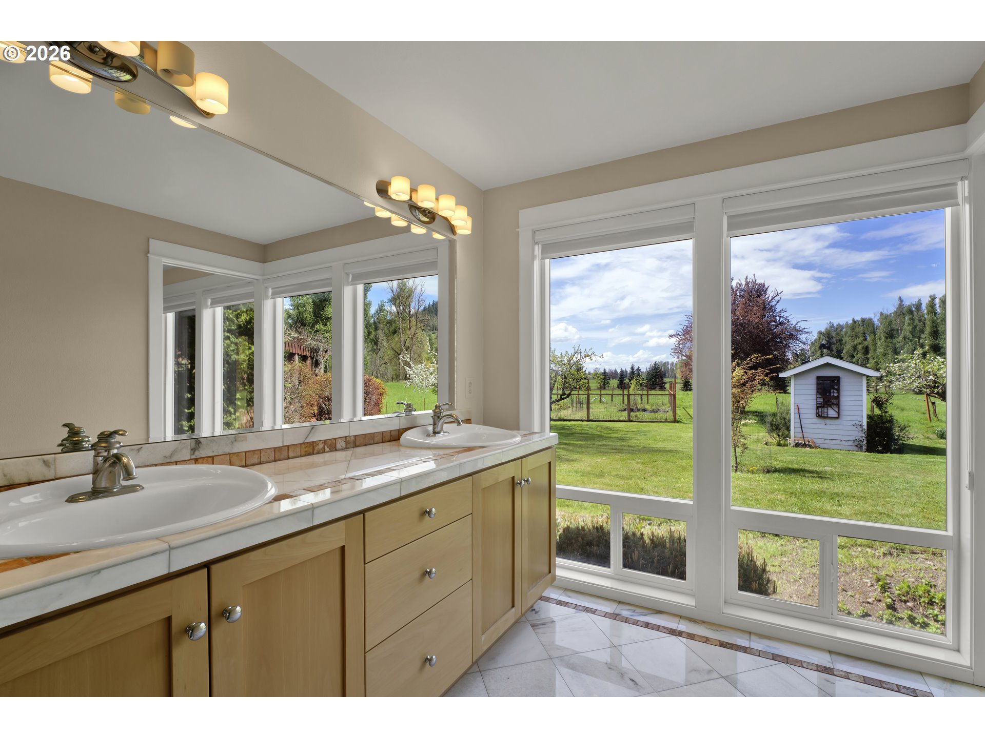 7924 Thurston Road Springfield, OR 97478 - Photo 24 of 45 a bathroom with a double vanity sink and a large mirror