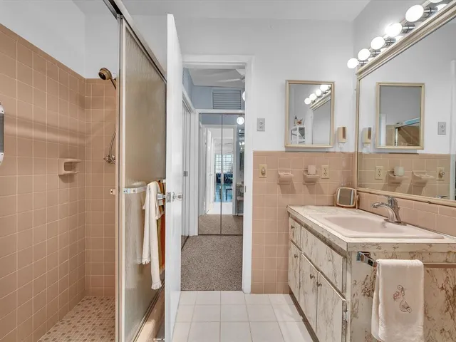 a backyard of a house with potted plants