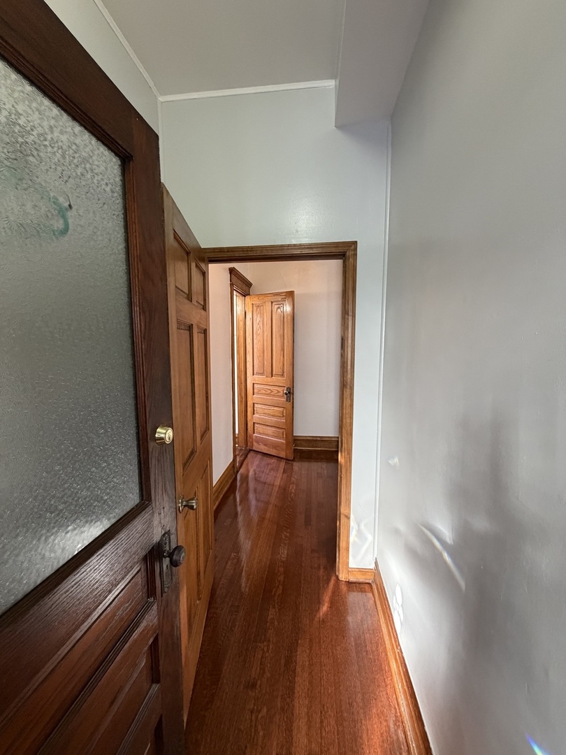 2624 West Walton Street, Unit 1 Chicago, IL 60622 - Photo 12 of 23 wooden floor in an empty room