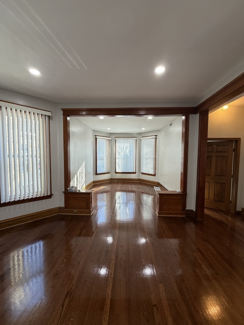 2624 West Walton Street, Unit 1 Chicago, IL 60622 - Photo 6 of 23 a view of empty room with wooden floor and fan