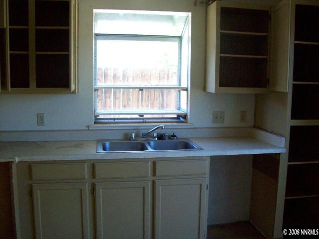 6119 Walnut Creek Road Reno, NV 89523 - Photo 3 of 9 a kitchen with a sink and a window
