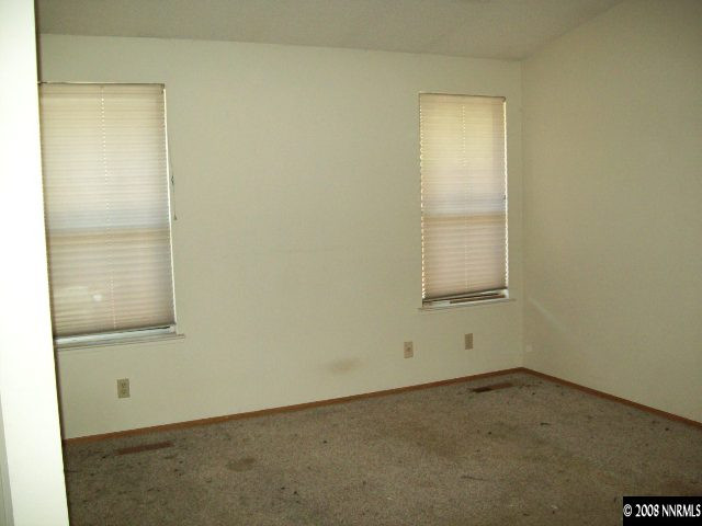 6119 Walnut Creek Road Reno, NV 89523 - Photo 8 of 9 an empty room with a window
