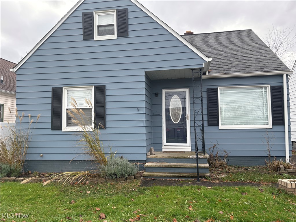 17914 Libby Road Maple Heights, OH 44137 - Photo 1 of 17 Bungalow-style home featuring a front lawn and roof with shingles
