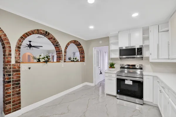 a dining room with furniture and window