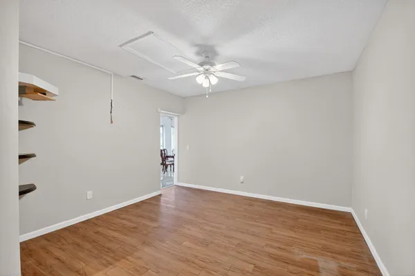 a view of an empty room with a window