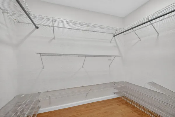 a large white bed in a white room