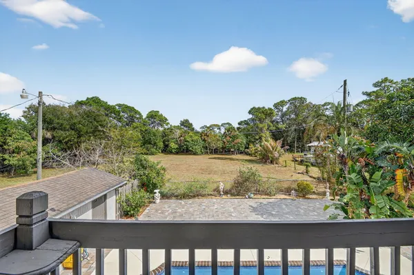 a view of a swimming pool with a patio