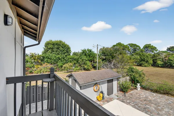 a view of a house with tub and chairs
