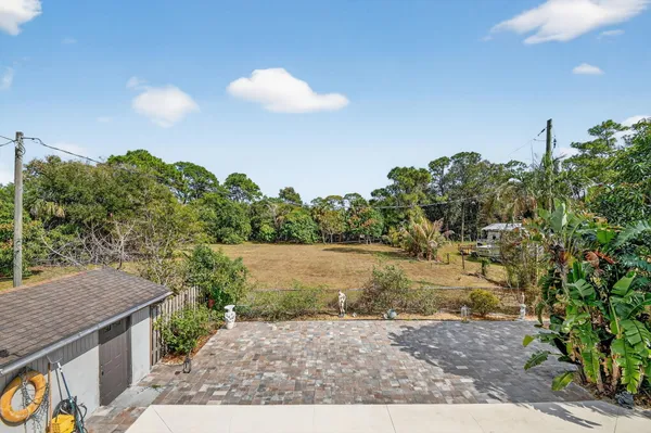 a backyard of a house with lots of green space