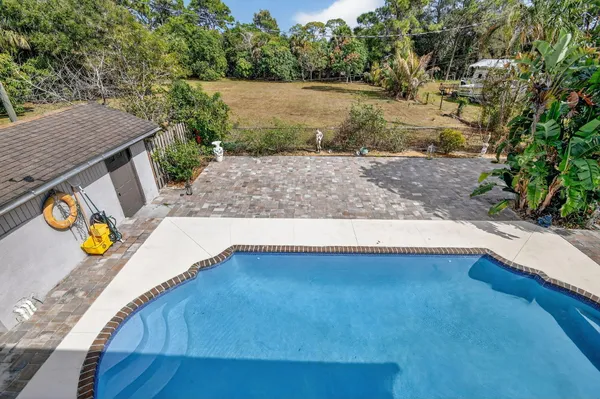 a view of a house with a yard and plant