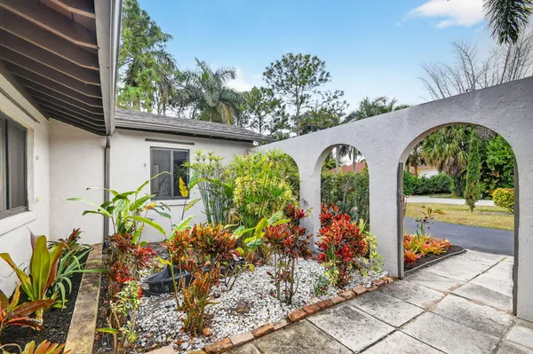 a living room with furniture and a ceiling fan