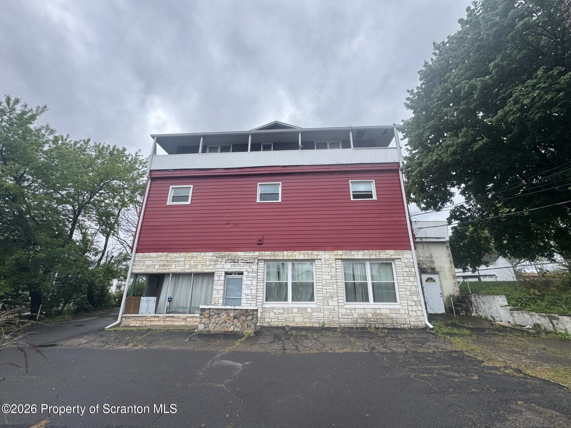 16 Maffett Street Plains, PA 18705 - Photo 1 of 19 a front view of a residential apartment building with a yard
