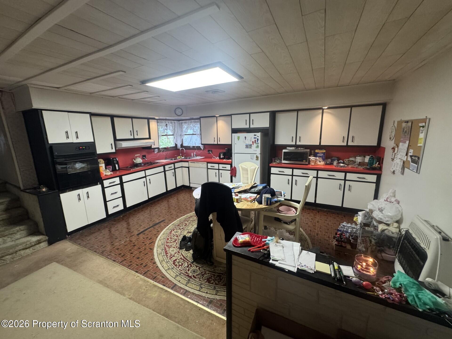 16 Maffett Street Plains, PA 18705 - Photo 5 of 19 a living room with furniture and a fireplace