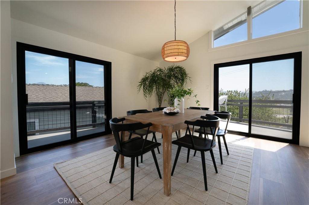 675 Huntington Road Cambria, CA 93428 - Photo 9 of 30 a view of a dining room with furniture window and wooden floor