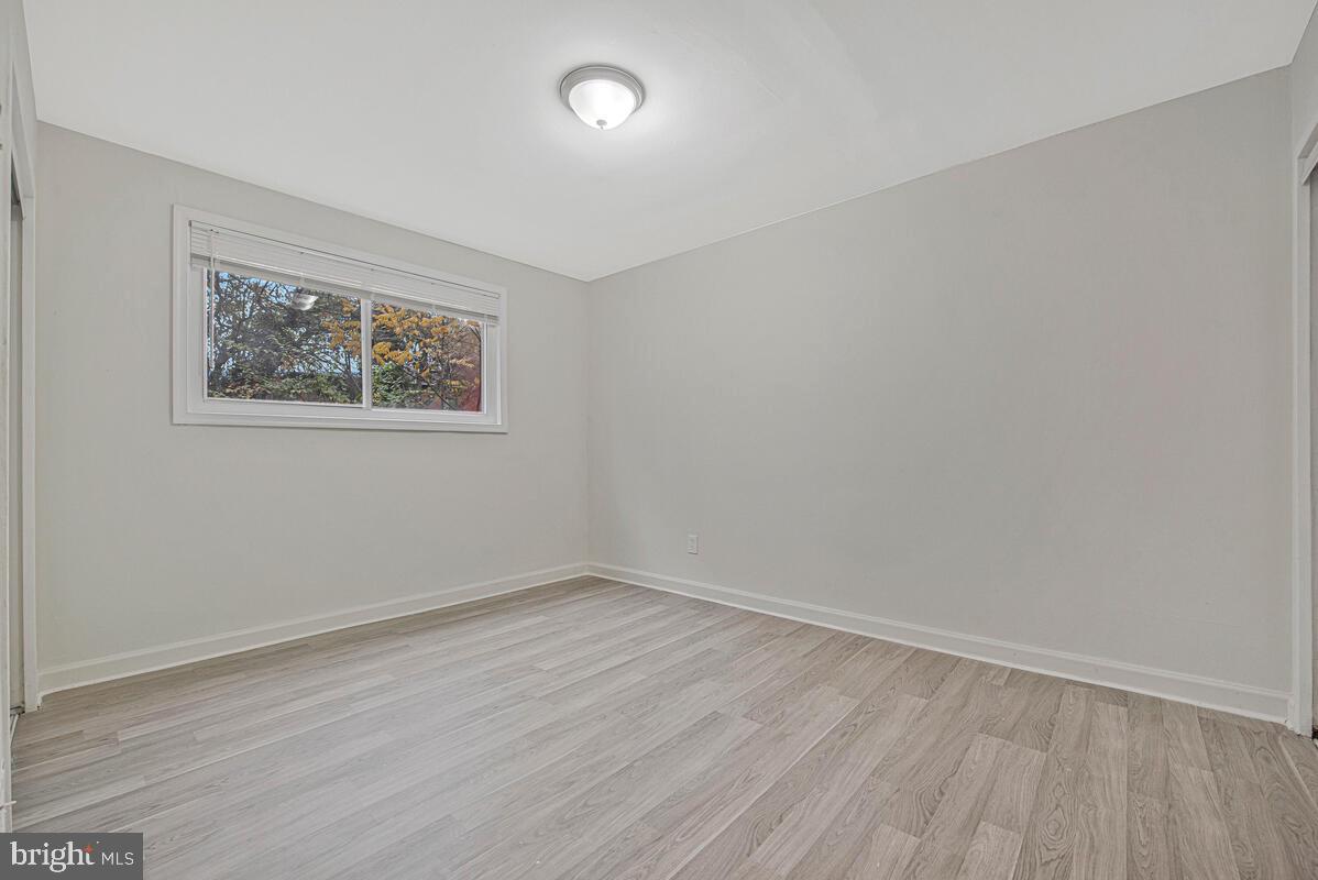 107 Joliet Street Washington, DC 20032 - Photo 16 of 52 wooden floor in an empty room with a window